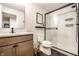 Clean bathroom with a glass shower, modern vanity, and neutral color scheme at 544 N Beville Ave, Indianapolis, IN 46201