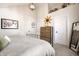 A well-lit bedroom featuring a bed with a wood frame, wood dresser, modern decor and natural light at 544 N Beville Ave, Indianapolis, IN 46201