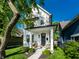 Charming two-story home with a beautifully landscaped front yard and inviting front porch at 544 N Beville Ave, Indianapolis, IN 46201