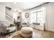 Open living room with hardwood floors, comfortable seating, and staircase access at 544 N Beville Ave, Indianapolis, IN 46201