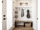 Functional mudroom with a built-in bench, storage baskets, and coat hooks for organized entryway at 544 N Beville Ave, Indianapolis, IN 46201