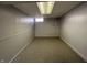 Clean basement area featuring carpet and painted walls, perfect for storage or finishing at 5450 E 18Th St, Indianapolis, IN 46218