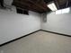 Clean basement area featuring epoxy flooring and painted walls, perfect for storage or finishing at 5450 E 18Th St, Indianapolis, IN 46218