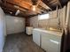 Functional basement laundry area with modern washer and dryer at 5450 E 18Th St, Indianapolis, IN 46218