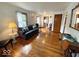 Bright living room with hardwood floors, a comfortable couch, and natural light at 5450 E 18Th St, Indianapolis, IN 46218