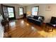 Cozy living room with wood floors, natural light, and a comfortable sofa at 5450 E 18Th St, Indianapolis, IN 46218