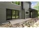 The home's backyard featuring a stone pathway and a view of the home's exterior and a screened-in porch at 5548 Painted Maple Ct, Indianapolis, IN 46254