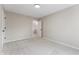 Cozy bedroom with neutral carpet, light-colored walls, and open doorway to hallway at 5548 Painted Maple Ct, Indianapolis, IN 46254