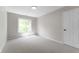 Clean bedroom with neutral carpet, natural light, and white door and trim at 5548 Painted Maple Ct, Indianapolis, IN 46254
