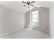 Comfortable bedroom with carpet, ceiling fan, window, and neutral paint color at 5548 Painted Maple Ct, Indianapolis, IN 46254