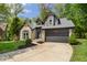 Attractive home showcasing stone and siding, complemented by a neatly paved driveway at 5548 Painted Maple Ct, Indianapolis, IN 46254