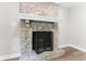 Stone fireplace with white mantle and black screen at 5548 Painted Maple Ct, Indianapolis, IN 46254