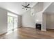 Spacious living room featuring a fireplace, vaulted ceilings, and lots of natural light at 5548 Painted Maple Ct, Indianapolis, IN 46254