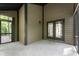 View of the screened-in porch with a concrete floor and access to the home's interior and a side yard at 5548 Painted Maple Ct, Indianapolis, IN 46254