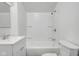 Well lit bathroom featuring white bathtub with shower, toilet and vanity at 555 S Auburn St, Indianapolis, IN 46241