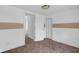 Clean bedroom with neutral carpet, white trim, and open closet at 555 S Auburn St, Indianapolis, IN 46241