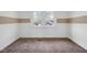 Neutral bedroom with two windows and carpet flooring at 555 S Auburn St, Indianapolis, IN 46241