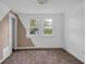 Sunlit bedroom with dual windows and carpet at 555 S Auburn St, Indianapolis, IN 46241