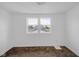 Airy bedroom filled with natural light from dual windows and neutral carpet at 555 S Auburn St, Indianapolis, IN 46241
