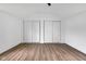 Spacious bedroom features large closets and wood-look flooring at 555 S Auburn St, Indianapolis, IN 46241