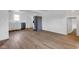 Bright kitchen featuring stainless steel appliances, wood-look flooring, and white cabinetry at 555 S Auburn St, Indianapolis, IN 46241
