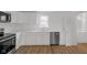 This kitchen features stainless steel appliances, white cabinets and light countertops at 555 S Auburn St, Indianapolis, IN 46241