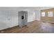 Spacious kitchen featuring stainless steel refrigerator with hardwood floors at 555 S Auburn St, Indianapolis, IN 46241