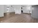 Living room featuring hardwood floors, bright white walls and a large window at 555 S Auburn St, Indianapolis, IN 46241