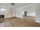 Bright, empty living room with wood floors, fresh paint, and a new staircase at 555 S Auburn St, Indianapolis, IN 46241