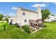 Cozy backyard features a charming pergola seating area and well-maintained lawn, perfect for outdoor enjoyment at 5617 Gainesway Dr, Greenwood, IN 46142