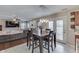 Open concept eat-in kitchen with a dark wood table, chairs and living room area at 5617 Gainesway Dr, Greenwood, IN 46142