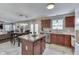 Bright kitchen with granite countertops, wooden cabinets, stainless steel appliances, and a charming breakfast nook at 5617 Gainesway Dr, Greenwood, IN 46142