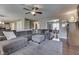 Large living room with hardwood floors, a sectional sofa, and an open layout connecting to dining area at 5617 Gainesway Dr, Greenwood, IN 46142