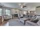 Cozy living area featuring a fireplace, open layout, hardwood floors, and a large sectional sofa at 5617 Gainesway Dr, Greenwood, IN 46142