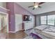 Spacious main bedroom featuring a ceiling fan, hard wood floors, and a calming atmosphere at 5617 Gainesway Dr, Greenwood, IN 46142