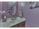 Charming powder room with a round mirror, pedestal sink, and a fresh, clean design at 5617 Gainesway Dr, Greenwood, IN 46142