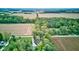 Breathtaking aerial view of a beautiful home surrounded by lush greenery and picturesque farmland at 5750 W 650 N, Thorntown, IN 46071