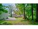 Exterior of home showing the expansive backyard area, and lush, mature trees at 5750 W 650 N, Thorntown, IN 46071