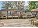 Expansive wooden deck with multiple seating areas and a grill, perfect for outdoor gatherings and relaxation at 5750 W 650 N, Thorntown, IN 46071