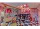 Finished basement bar area with checkered floors, unique lighting, and retro Coca-Cola decor at 5750 W 650 N, Thorntown, IN 46071