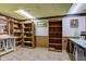 Open basement space with wood shelving and a functional workspace at 5750 W 650 N, Thorntown, IN 46071