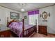 Inviting bedroom with a four-poster bed, decorative accents, and soft lighting, creating a comfortable and stylish space at 5750 W 650 N, Thorntown, IN 46071