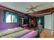 Bedroom with hardwood floors, ceiling fan, and access to the sitting room at 5750 W 650 N, Thorntown, IN 46071