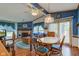 Open concept dining room with view of living room, features natural light and hardwood flooring at 5750 W 650 N, Thorntown, IN 46071