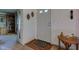 Bright foyer with a white door, wood floors, and classic decor at 5750 W 650 N, Thorntown, IN 46071