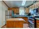 Charming kitchen with stainless steel appliances, wood cabinets, and center island at 5750 W 650 N, Thorntown, IN 46071