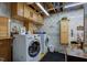 Functional laundry room with cabinetry and modern washer and dryer at 5750 W 650 N, Thorntown, IN 46071