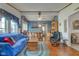 Spacious living room featuring open concept with dining area, hardwood floors, and comfortable seating at 5750 W 650 N, Thorntown, IN 46071