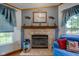 Close up of living room brick fireplace featuring decorative mantel and accents at 5750 W 650 N, Thorntown, IN 46071