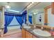 Relaxing main bathroom with a jacuzzi tub, dual sinks, and vanity, offering a luxurious spa-like experience at 5750 W 650 N, Thorntown, IN 46071